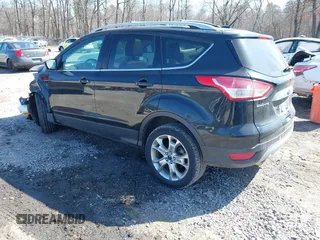 2014 Ford Escape Titanium with VIN 1FMCU9JX2EUA96338, listed as a IAAI auction lot 41806850 with 127,745 mi miles. Bid and sale history available at carsss.com. Image 3.