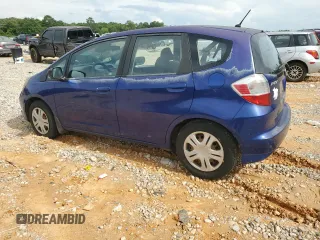 2009 Honda Fit with VIN JHMGE882X9S007865, listed as a Copart auction lot 61025875 with 159,919 mi miles and Clean title. Bid and sale history available at DreamBid. Image 2.