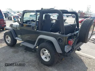 2003 Jeep Wrangler Sport with VIN 1J4FA49S23P328867, listed as a IAAI auction lot 41354414 with 96,703 mi miles. Bid and sale history available at carsss.com. Image 3.