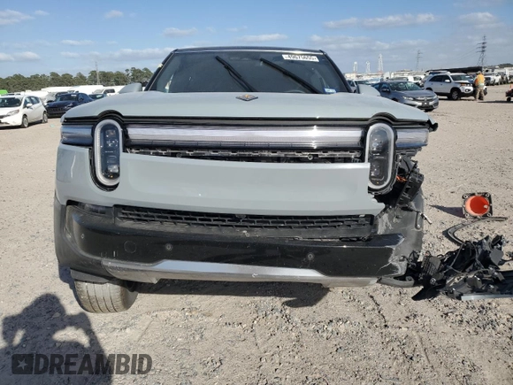 2025 Rivian R1S Adventure z VIN 7PDSGBBA5SN045424, wystawiony jako Copart lot #49675655 z przebiegiem Nie podano mil oraz Szkoda całkowita • Salvage title. Historia ofert i sprzedaży dostępna na DreamBid. Obrazek 5.