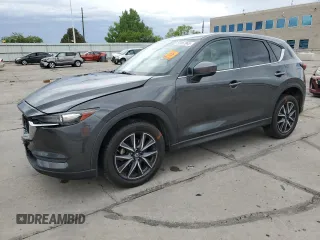 2018 Mazda CX-5 Touring z VIN JM3KFBCM4J0349687, wystawiony jako Copart lot #55857945 z przebiegiem Nie podano mil oraz Szkoda całkowita • Salvage title. Historia ofert i sprzedaży dostępna na DreamBid. Obrazek 1.
