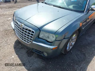2006 Chrysler 300 C with VIN 2C3KA63H76H141246, listed as a IAAI auction lot 42035339 with 208,798 mi miles. Bid and sale history available at carsss.com. Image 6.
