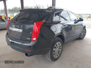 2014 Cadillac SRX Luxury Collection z VIN 3GYFNEE36ES677883, wystawiony jako IAAI lot #42260861 z przebiegiem 51 730 mil mil oraz . Historia ofert i sprzedaży dostępna na DreamBid. Obrazek 4.