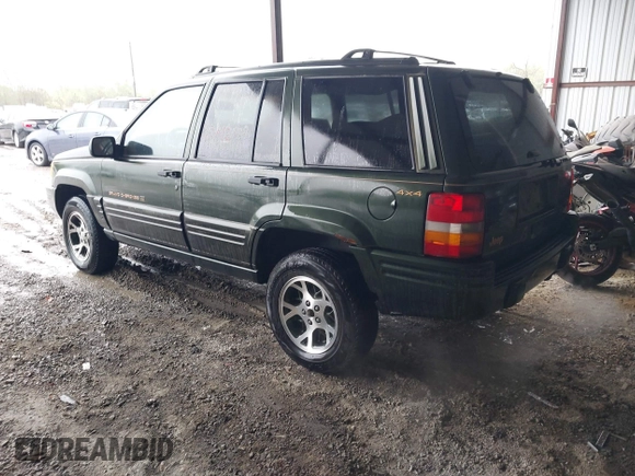 1997 Jeep Grand Cherokee Limited with VIN 1J4GZ78Y5VC723429, listed as a IAAI auction lot 42012836 with 231,126 mi miles. Bid and sale history available at carsss.com. Image 3.