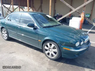 2004 Jaguar X-Type with VIN SAJEA51C24WD81320, listed as a IAAI auction lot 41717921 with 71,859 mi miles. Bid and sale history available at carsss.com. Image 1.