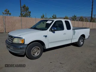 2002 Ford F-150 XL with VIN 1FTRX17W22KE34494, listed as a IAAI auction lot 41689313 with 250,243 mi miles. Bid and sale history available at carsss.com. Image 2.
