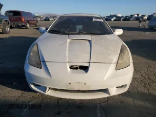 2000 Toyota Celica GTS with VIN JTDDY32T6Y0019229, listed as a Copart auction lot 77842174 with 143,514 mi miles and Salvage Title. Bid and sale history available at carsss.com. Image 5.