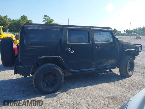 2003 Hummer H2 z VIN 5GRGN23UX3H140510, wystawiony jako IAAI lot #42325527 z przebiegiem 140 010 mil mil oraz . Historia ofert i sprzedaży dostępna na DreamBid. Obrazek 14.