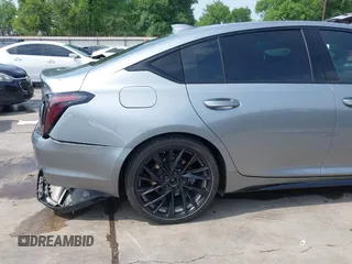 2023 Cadillac CT5 Sport z VIN 1G6DP5RK7P0113696, wystawiony jako IAAI lot #41904906 z przebiegiem 89 191 mil mil oraz . Historia ofert i sprzedaży dostępna na DreamBid. Obrazek 22.