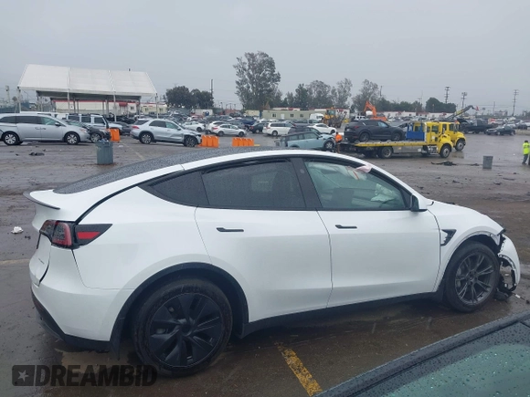 2024 Tesla Model Y Long Range z VIN 7SAYGDEEXRF230169, wystawiony jako IAAI lot #41723049 z przebiegiem Nie podano mil oraz . Historia ofert i sprzedaży dostępna na DreamBid. Obrazek 13.