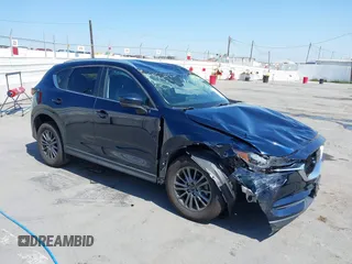 2020 Mazda CX-5 Touring z VIN JM3KFACM1L0861212, wystawiony jako IAAI lot #42301692 z przebiegiem Nie podano mil oraz . Historia ofert i sprzedaży dostępna na DreamBid. Obrazek 1.