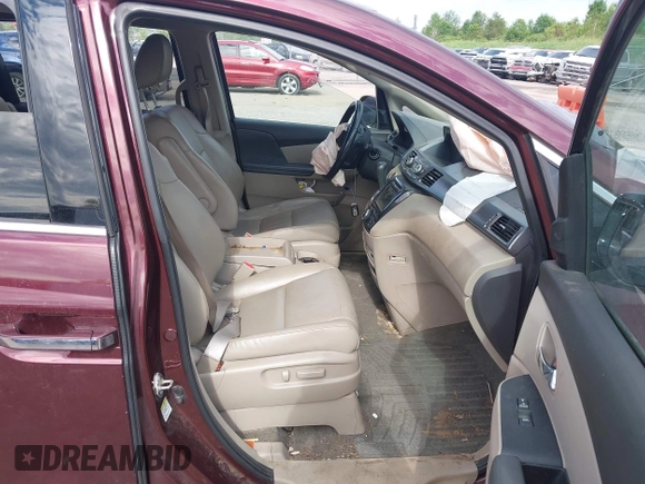 2014 Honda Odyssey Touring with VIN 5FNRL5H90EB120999, listed as a IAAI auction lot 42541370 with 96,454 mi miles and . Bid and sale history available at DreamBid. Image 5.