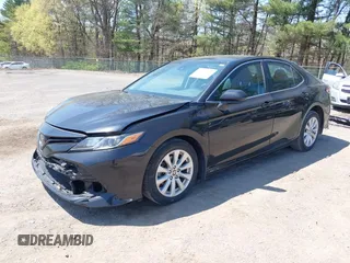 2020 Toyota Camry LE with VIN 4T1C11AK9LU387012, listed as a IAAI auction lot 42103647 with 64,049 mi miles and . Bid and sale history available at carsss.com. Image 2.