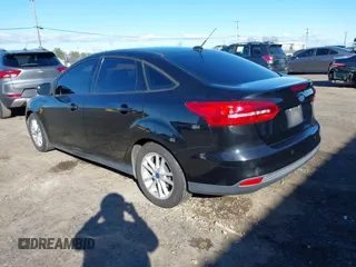 2015 Ford Focus SE with VIN 1FADP3F21FL262033, listed as a IAAI auction lot 41521714 with 101,890 mi miles. Bid and sale history available at carsss.com. Image 3.
