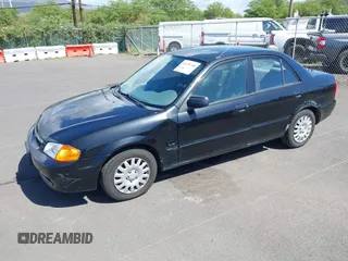 1999 Mazda Protege DX z VIN JM1BJ2228X0108327, wystawiony jako IAAI lot #41630708 z przebiegiem 171 459 mil mil oraz . Historia ofert i sprzedaży dostępna na DreamBid. Obrazek 2.