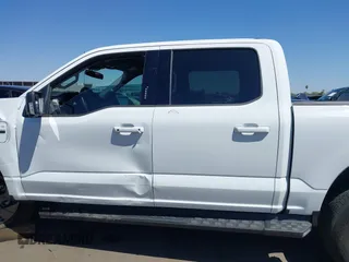 2023 Ford F-150 Lightning Pro with VIN 1FTVW1EL4PWG42578, listed as a IAAI auction lot 41992446 with 26,729 mi miles and . Bid and sale history available at DreamBid. Image 14.