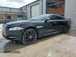 2014 Jaguar XJ Portfolio with VIN SAJWA2GZ2E8V64993, listed as a Copart auction lot 88774965 with 78,689 mi miles and Salvage title. Bid and sale history available at DreamBid. Image 1.