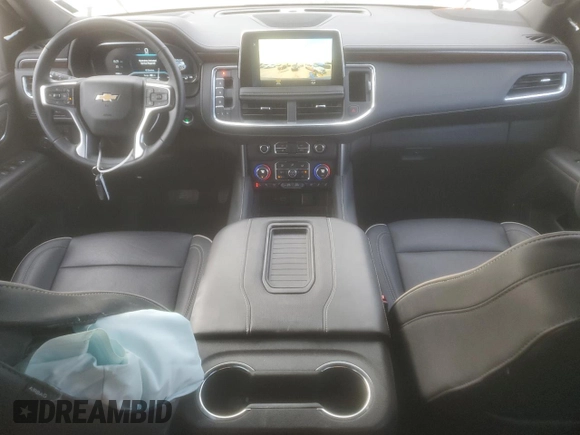 2023 Chevrolet Tahoe Premier with VIN 1GNSCSKD4PR563710, listed as a Copart auction lot 84965394 with 17,528 mi miles and Salvage title. Bid and sale history available at DreamBid. Image 8.