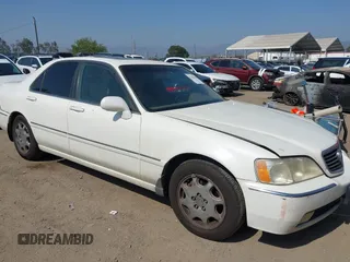2004 Acura RL w/Navigation System z VIN JH4KA96634C005251, wystawiony jako IAAI lot #42386644 z przebiegiem 238 540 mil mil oraz . Historia ofert i sprzedaży dostępna na DreamBid. Obrazek 1.