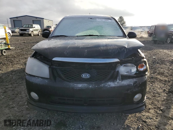 2005 Kia Spectra with VIN KNAFE161655093051, listed as a Copart auction lot 77821904 with 104,874 mi miles and Salvage Title. Bid and sale history available at carsss.com. Image 5.