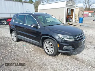 2012 Volkswagen Tiguan SE with VIN WVGAV7AX3CW597118, listed as a IAAI auction lot 41800860 with 96,988 mi miles and . Bid and sale history available at DreamBid. Image 1.