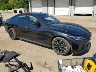 2022 BMW i4 eDrive40 with VIN WBY73AW05NFM59840, listed as a Copart auction lot 55608094 with 25,720 mi miles and Salvage Title. Bid and sale history available at carsss.com. Image 4.