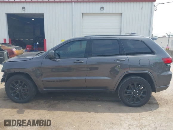 2018 Jeep Grand Cherokee Laredo E with VIN 1C4RJFAG7JC294905, listed as a IAAI auction lot 42452977 with 75,916 mi miles and . Bid and sale history available at DreamBid. Image 14.