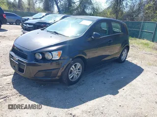 2014 Chevrolet Sonic LT with VIN 1G1JC6SB6E4210561, listed as a IAAI auction lot 42073197 with 100,945 mi miles. Bid and sale history available at carsss.com. Image 2.