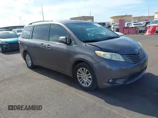 2014 Toyota Sienna XLE with VIN 5TDYK3DC2ES438980, listed as a IAAI auction lot 42067750 with 143,728 mi miles and . Bid and sale history available at DreamBid. Image 1.