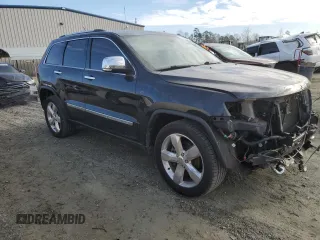 2013 Jeep Grand Cherokee Overland with VIN 1C4RJECT6DC655355, listed as a Copart auction lot 85654554 with 135,343 mi miles and Salvage Title. Bid and sale history available at carsss.com. Image 4.
