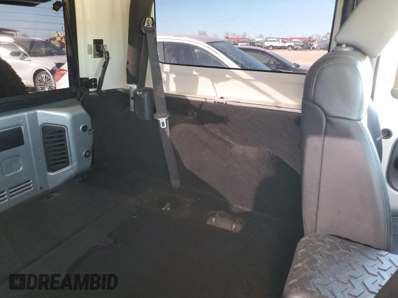 2009 Jeep Wrangler Rubicon with VIN 1J8GA64159L700909, listed as a Copart auction lot 86308954 with 138,065 mi miles and Salvage title. Bid and sale history available at DreamBid. Image 11.