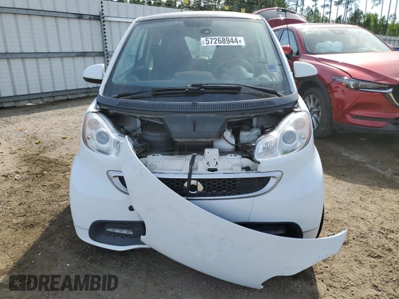 2015 Smart fortwo Passion z VIN WMEEJ3BA8FK800733, wystawiony jako Copart lot #57268944 z przebiegiem Nie podano mil oraz Szkoda całkowita • Salvage title. Historia ofert i sprzedaży dostępna na DreamBid. Obrazek 5.