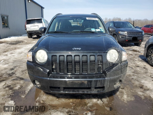 2010 Jeep Compass Sport with VIN 1J4NF4FB2AD591523, listed as a Copart auction lot 48809775 with 105,720 mi miles and Salvage Title. Bid and sale history available at carsss.com. Image 5.