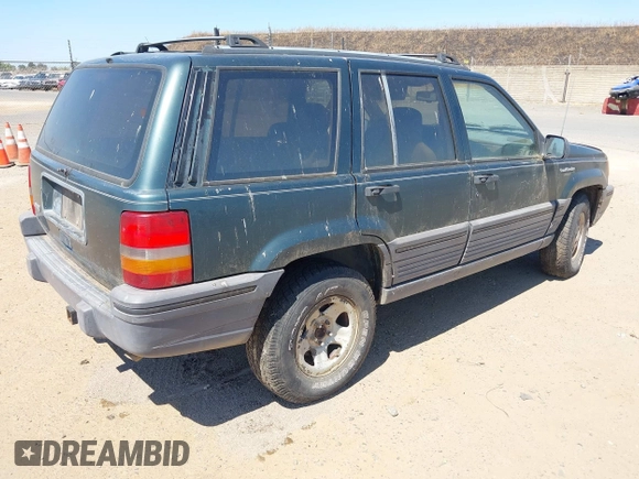 1994 Jeep Grand Cherokee Laredo with VIN 1J4GZ58S2RC118502, listed as a IAAI auction lot 42701778 with 420,559 mi miles and . Bid and sale history available at DreamBid. Image 4.