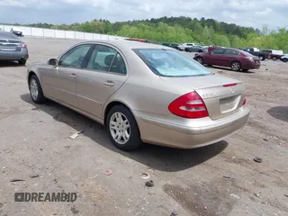 2003 Mercedes-Benz E-Class 3.2L with VIN WDBUF65J23A243178, listed as a IAAI auction lot 41974660 with 134,459 mi miles. Bid and sale history available at carsss.com. Image 3.