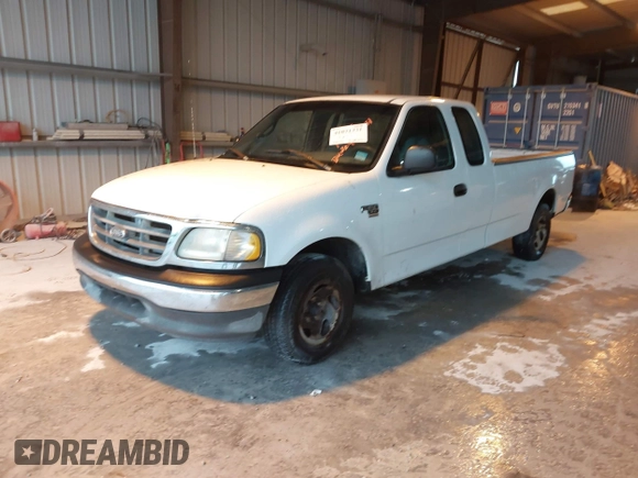 2002 Ford F-150 XL with VIN 1FTRX17L52NA38404, listed as a IAAI auction lot 41871731 with 366,564 mi miles. Bid and sale history available at carsss.com. Image 2.
