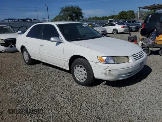 1997 Toyota Camry LE z VIN JT2BG22K4V0077954, wystawiony jako Copart lot #57682355 z przebiegiem 254 596 mil mil oraz Szkoda całkowita • Salvage title. Historia ofert i sprzedaży dostępna na DreamBid. Obrazek 4.