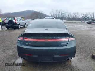 2015 Lincoln MKZ z VIN 3LN6L2J90FR616800, wystawiony jako IAAI lot #41683401 z przebiegiem 92 239 mil mil oraz . Historia ofert i sprzedaży dostępna na DreamBid. Obrazek 16.