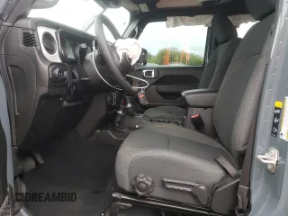2024 Jeep Wrangler Sport S with VIN 1C4PJXDG1RW305304, listed as a Copart auction lot 57555635 with 5,705 mi miles and Salvage title. Bid and sale history available at DreamBid. Image 7.