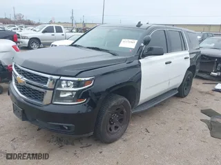 2018 Chevrolet Tahoe Commercial with VIN 1GNLCDEC1JR312458, listed as a IAAI auction lot 41371563 with 114,086 mi miles. Bid and sale history available at carsss.com. Image 2.