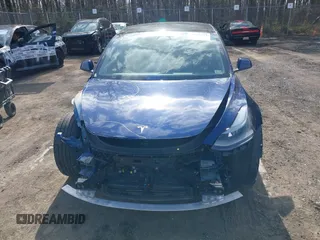 2022 Tesla Model 3 with VIN 5YJ3E1EA7NF188417, listed as a IAAI auction lot 41885623 with 105,457 mi miles and . Bid and sale history available at DreamBid. Image 12.