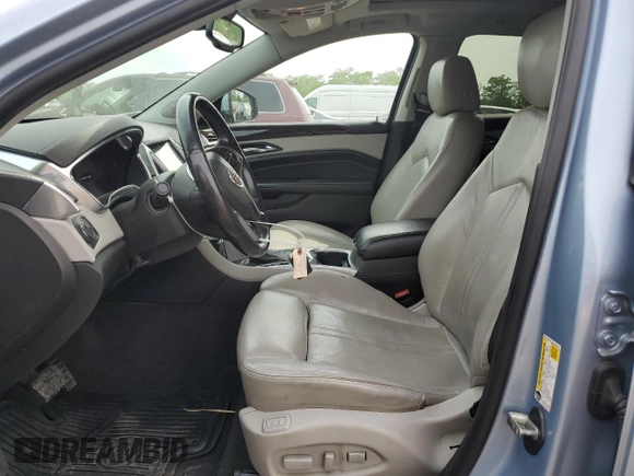 2013 Cadillac SRX Luxury Collection z VIN 3GYFNCE36DS535763, wystawiony jako Copart lot #57084845 z przebiegiem 92 156 mil mil oraz Szkoda całkowita • Salvage title. Historia ofert i sprzedaży dostępna na DreamBid. Obrazek 7.