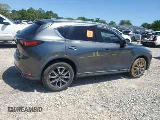2018 Mazda CX-5 Grand Touring with VIN JM3KFADM9J0343621, listed as a Copart auction lot 52284475 with 129,776 mi miles and Salvage Title. Bid and sale history available at DreamBid. Image 3.