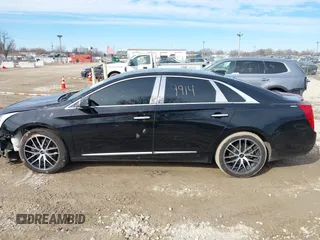 2015 Cadillac XTS Luxury z VIN 2G61N5S35F9155543, wystawiony jako IAAI lot #41699914 z przebiegiem 120 700 mil mil oraz . Historia ofert i sprzedaży dostępna na DreamBid. Obrazek 15.