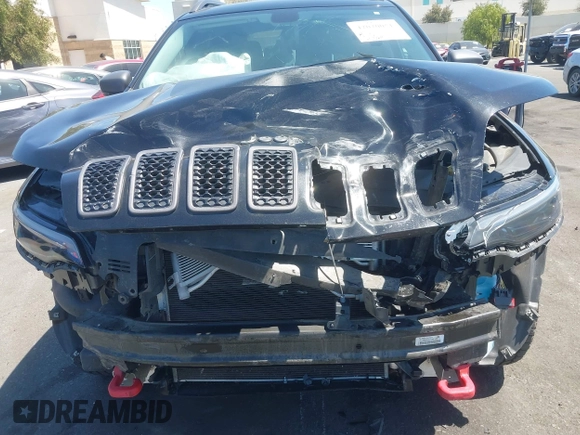2019 Jeep Cherokee Trailhawk with VIN 1C4PJMBXXKD433284, listed as a IAAI auction lot 42020051 with 57,089 mi miles and . Bid and sale history available at DreamBid. Image 6.