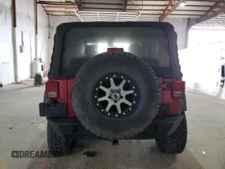 2012 Jeep Wrangler Sport with VIN 1C4AJWAG5CL233049, listed as a Copart auction lot 52328865 with 185,388 mi miles and Salvage title. Bid and sale history available at DreamBid. Image 6.