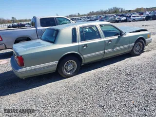 1994 Lincoln Town Car Signature with VIN 1LNLM82W5RY616904, listed as a IAAI auction lot 41811628 with 163,653 mi miles. Bid and sale history available at carsss.com. Image 4.