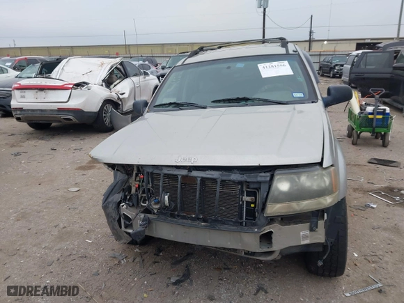 2004 Jeep Grand Cherokee Laredo with VIN 1J4GX48S44C301120, listed as a IAAI auction lot 41281556 with 267,246 mi miles. Bid and sale history available at carsss.com. Image 13.