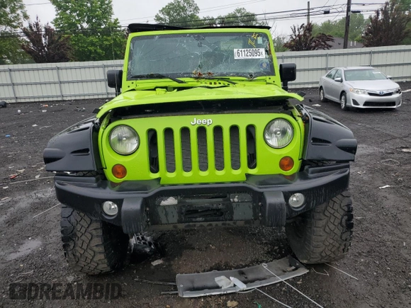 2012 Jeep Wrangler Sport with VIN 1C4AJWAG2CL233722, listed as a Copart auction lot 61125095 with 49,864 mi miles and Salvage title. Bid and sale history available at DreamBid. Image 5.