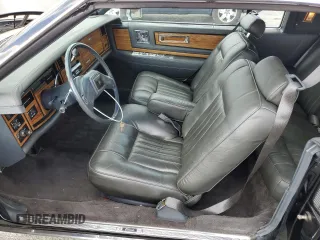 1985 Cadillac Eldorado z VIN 1G6EL578XFE640091, wystawiony jako Copart lot #71849374 z przebiegiem 30 631 mil mil oraz Szkody całkowita. Historia ofert i sprzedaży dostępna na DreamBid. Obrazek 7.